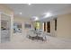 Basement dining area with white table, chairs and doors leading to outdoor living space at 417 Swans Mill Xing, Raleigh, NC 27614
