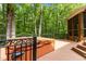 Hot tub on a private deck surrounded by lush greenery, creating a serene outdoor retreat at 417 Swans Mill Xing, Raleigh, NC 27614