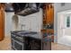 This luxurious kitchen features an expansive island with a stainless steel range at 417 Swans Mill Xing, Raleigh, NC 27614