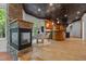 Gourmet kitchen with stone fireplace, custom cabinetry, modern appliances and adjacent dining space at 417 Swans Mill Xing, Raleigh, NC 27614