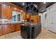 Stunning kitchen features an island, custom cabinets and a unique and decorative tile ceiling at 417 Swans Mill Xing, Raleigh, NC 27614