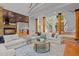 A spacious living room showcasing elegant design elements like the spiral staircase and decorative columns at 417 Swans Mill Xing, Raleigh, NC 27614