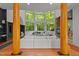 Spacious living room with floor-to-ceiling windows, fireplace, and ample seating space at 417 Swans Mill Xing, Raleigh, NC 27614