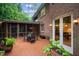 Spacious outdoor dining area with a screened-in porch and access to the home's interior at 417 Swans Mill Xing, Raleigh, NC 27614
