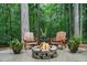 Outdoor firepit area with Adirondack chairs, ideal for enjoying cozy evenings in nature at 417 Swans Mill Xing, Raleigh, NC 27614
