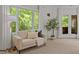 Cozy sitting area with large windows and a comfortable couch providing a relaxing space at 417 Swans Mill Xing, Raleigh, NC 27614