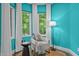 Cozy sitting area with natural light streaming through the large windows, showcasing a tranquil and serene ambiance at 417 Swans Mill Xing, Raleigh, NC 27614