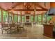 Bright sunroom with a fireplace, comfortable seating, and scenic views of the surrounding greenery at 417 Swans Mill Xing, Raleigh, NC 27614
