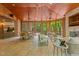 Inviting sunroom featuring a fireplace, comfortable seating, and access to an outdoor deck and scenic view at 417 Swans Mill Xing, Raleigh, NC 27614