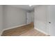 This bedroom has wood flooring, a ceiling fan, and neutral-colored walls at 423 N Main St, Wendell, NC 27591