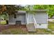 Exterior view of a home with a set of steps leading to the front door at 423 N Main St, Wendell, NC 27591