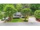 Charming home with mature trees, a driveway, and landscaping at 423 N Main St, Wendell, NC 27591