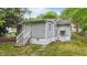 Exterior view of a home with a set of steps leading to the front door at 423 N Main St, Wendell, NC 27591