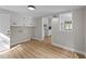 Utility room features abundant storage, new wood-look flooring, and is conveniently adjacent to kitchen at 423 N Main St, Wendell, NC 27591