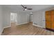 Spacious living room with wood-look floors, freshly painted walls, and abundant natural light at 423 N Main St, Wendell, NC 27591