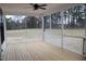 Finished back porch with screened windows, ceiling fan and a view of the backyard at 4330 Medicus Ln, Franklinton, NC 27525