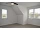 This bedroom is spacious with two large windows and a ceiling fan at 4330 Medicus Ln, Franklinton, NC 27525