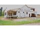 Exterior construction of a new home with protective wrap, showcasing the framing and initial stages of building at 4330 Medicus Ln, Franklinton, NC 27525