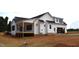 Exterior view of a home showing a covered porch and garage at 4330 Medicus Ln, Franklinton, NC 27525