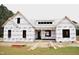 Exterior view of a home under construction with protective wrap, framing the structure's layout at 4330 Medicus Ln, Franklinton, NC 27525