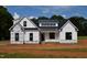 New construction home featuring a modern farmhouse design with black window frames at 4330 Medicus Ln, Franklinton, NC 27525