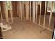 Interior framing featuring exposed wooden studs, plywood flooring, and staircase structure, ready for finishing touches at 4330 Medicus Ln, Franklinton, NC 27525