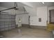 Finished garage with garage door, stairs, and painted white walls, offering ample space at 4330 Medicus Ln, Franklinton, NC 27525