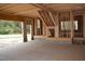 An unfinished garage with open access, stairs leading to upper level, and framed construction at 4330 Medicus Ln, Franklinton, NC 27525