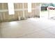 Unfinished garage space featuring concrete slab, bright windows and exposed studding ready for completion at 4330 Medicus Ln, Franklinton, NC 27525