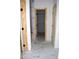 Hallway featuring tile floors and access to a walk-in closet at 4330 Medicus Ln, Franklinton, NC 27525