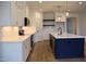 Modern kitchen features white cabinetry, quartz countertops, and stainless steel appliances at 4330 Medicus Ln, Franklinton, NC 27525