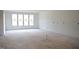 Spacious living room showcasing ample natural light and potential for modern design at 4330 Medicus Ln, Franklinton, NC 27525