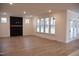 Bright living room with a fireplace, large windows, light wood flooring, and white trim at 4330 Medicus Ln, Franklinton, NC 27525