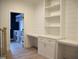 Bright office with built-in shelves, white cabinetry, and desk space, providing an organized workspace at 4330 Medicus Ln, Franklinton, NC 27525