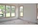 Unfinished room with bare walls, trim and windows ready for finishes and customization at 4330 Medicus Ln, Franklinton, NC 27525