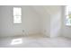 Empty room featuring two windows and slanted wall at 4330 Medicus Ln, Franklinton, NC 27525