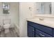 Bathroom featuring a blue vanity cabinet and tile floors at 5013 Dunwoody Trl, Raleigh, NC 27606