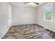 Bedroom featuring a window and wood-look floors at 5013 Dunwoody Trl, Raleigh, NC 27606