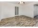 Bright bedroom with a ceiling fan and wood-look floors at 5013 Dunwoody Trl, Raleigh, NC 27606