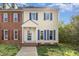 Charming two-story home featuring blue shutters, cream siding, and a welcoming front entrance at 5013 Dunwoody Trl, Raleigh, NC 27606