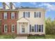 Charming two-story home featuring blue shutters, cream siding, and a welcoming front entrance at 5013 Dunwoody Trl, Raleigh, NC 27606