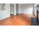 Open living room with hardwood floors and neutral gray walls at 5013 Dunwoody Trl, Raleigh, NC 27606