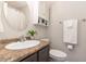 Bathroom vanity with granite countertops, oval mirror, and traditional fixtures at 5033 Knightsbridge Way, Raleigh, NC 27604