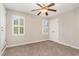 Cozy bedroom featuring a ceiling fan, white shutters, and neutral walls at 5033 Knightsbridge Way, Raleigh, NC 27604