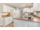 Spacious kitchen with granite countertops, white appliances, a tile floor and ample cabinet space at 5033 Knightsbridge Way, Raleigh, NC 27604