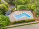 Aerial view of a community pool surrounded by lush greenery and a parking area at 5033 Knightsbridge Way, Raleigh, NC 27604