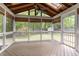 Charming screened porch with wood ceiling and skylight providing a serene outdoor space at 5033 Knightsbridge Way, Raleigh, NC 27604