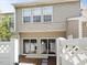 Home exterior featuring a small fenced-in backyard with sliding glass doors and privacy at 5044 Brooke Lauren Ln, Raleigh, NC 27616