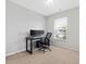 Neutral toned bedroom with carpet, large window, a desk set-up and ample space at 5044 Brooke Lauren Ln, Raleigh, NC 27616
