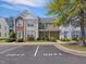 Charming townhome with brick and siding exterior, manicured landscaping and assigned parking at 5044 Brooke Lauren Ln, Raleigh, NC 27616